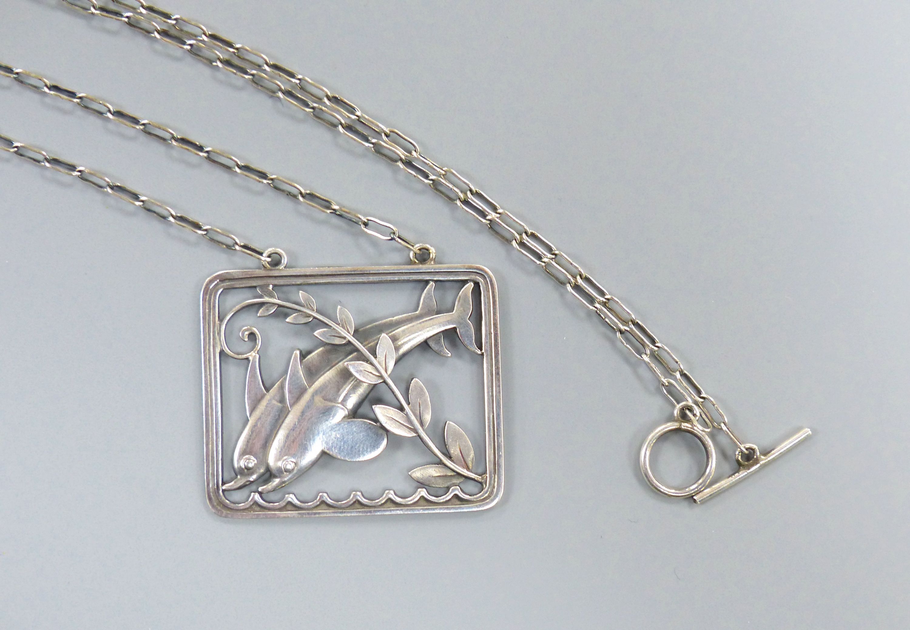 A Georg Jensen sterling twin leaping dolphin with frond rectangular pendant necklace, no. 94, pendant, 36mm, chain, 58cm.